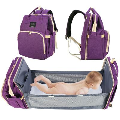 China Water Resistant Custom Cartoon Pattern Scattered Crib Stroller Can Drag Shoulder Folding Mommy Diaper Bag for sale