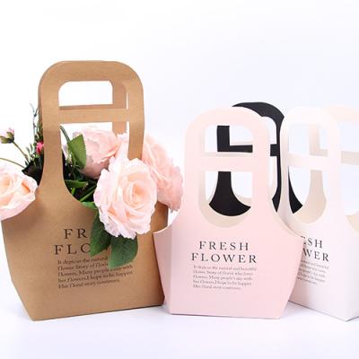 China Recyclable Customize Kraft Paper Handles For Flower Printing Fruits And Vegetables Recycled Wholesale Shopping Art Design Paper Bag for sale