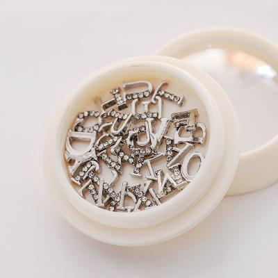 China 3d Nail Art DIY Decoration 26/Set Metal Luxury Silver Gold Crystal Rhinestone English Letter Nail Charm For Nails for sale