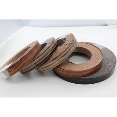 China Plastic Strip Funiture Dark Edging Accessory Furniture Wood Panel PVC Edging Dark Edging for sale