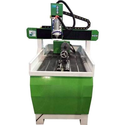 China Hotels 6090 Type Small Tabletop Machine 3d CNC Carving Engraving Machine for sale