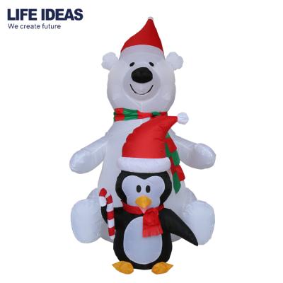 China 5.5FT Christmas Inflatable Outdoor Christmas Inflatable Animated Polar Bear With Penguin for sale