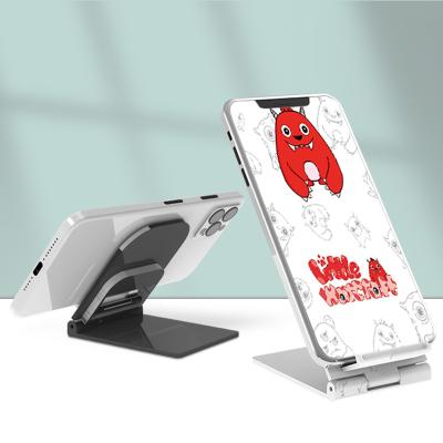 China New Arrival Portable Universal Plastic Mobile Phone Stand Adjustable Foldable Cell Phone Desk Stand With Logo Customized for sale