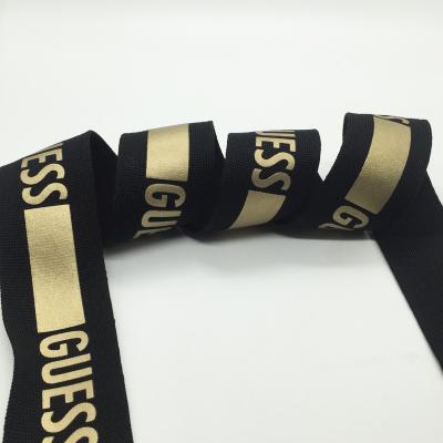 China Viable Wholesale Customized Logo Polyester Double Color Knitting Printing Gold Webbing For Garment Accessories for sale