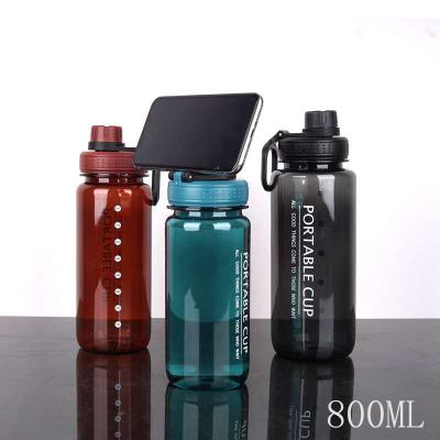 China Creative Viable Large Capacity Creative Black Red Portable Fashion Llue Cup Water Holder Mobile Phone 600/800ml Plastic Water Bottle for sale