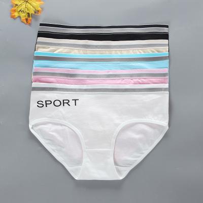 China Wholesale Breathable Letter Printing Teen Girl's Fashion Underwear Solid Cotton Mid Waisted Underwear For Children for sale