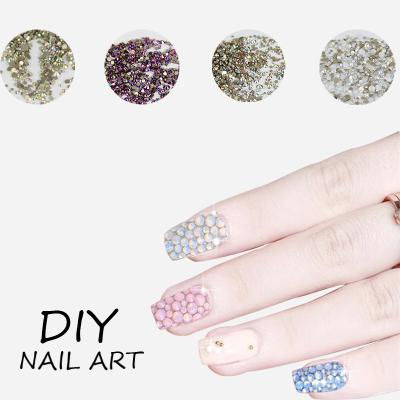 China Luxury Wholesale Designs Fashion Bling Polished Faceted Flatback Nail Art Glass Regular Rhinestones for sale