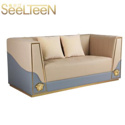 China Modern Light Blue Chesterfield Velvet Sofa With Brass Base Living Room Layout for sale