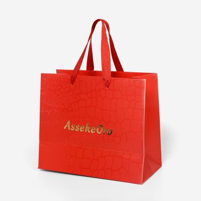 China Handmade High Quality Printed Red Paper Bags Bolsas De Papel Custom Logo Shopping Ribbon Handle Women Brands Wear Clothing for sale