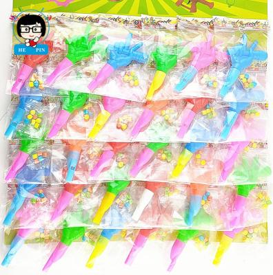 China Cartoon toys high quality soft hard candy granule voice fun game whistling toys plastic candy for sale