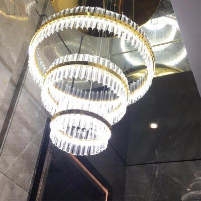 China Modern Post Modern Living Room Lighting Long Gold Round Glass Chandelier 3 Tiers Crystal Chandelier for sale