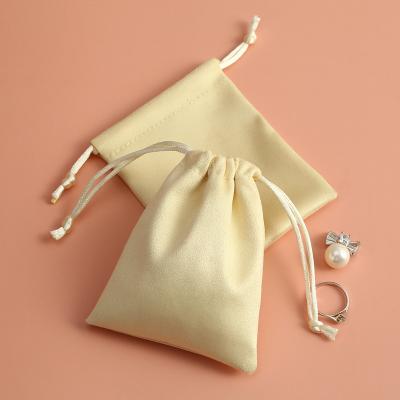 China Custom Small Travel Cloth Packaging Earring Pocket Suede Leather Ring Bracelet Pouch Logo Bracelet Necklace Earring Bag for sale