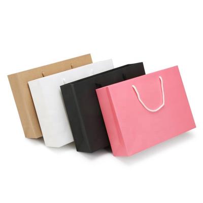 China Recyclable Custom Paper Bags With Your Own Logo Cardboard Packaging White Brown Black Kraft Paper Gift Pink Craft Paper Shopping Bag for sale