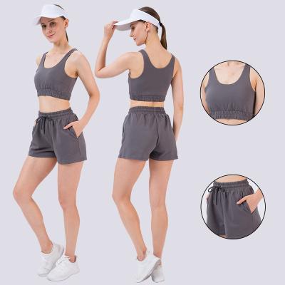 China Breathable Two Piece Women Workout Sports Bra Vest Crop Top Loose Sports Set Seamless Fitness Yoga Shorts for sale