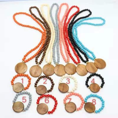 China 2022 Vintage Monogram Elasticity Wooden Bead Necklace Set Big Disc Monogram Necklace for sale