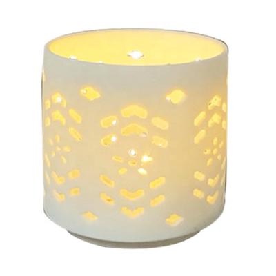 China Special sale cheap hot quality white ceramic candle holder hollowed out for home decor for sale