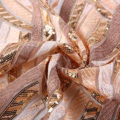 China New Fashion Good Price Net Net Embroidery Sequin Gold Fabric for sale