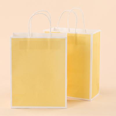 China Recycled Materials Customer Kraft Paper Flower Luxury Yellow Wholesale Paper Bags With Logo Print for sale