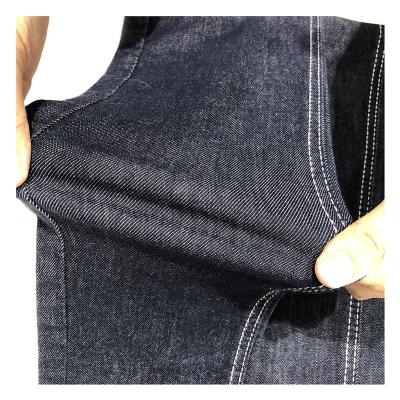 China Shrink-Resistant 8.9Oz Dk Blue Fadeless Mid Stretch Cotton Jeans Denim Twill Fabric Textile For Women for sale