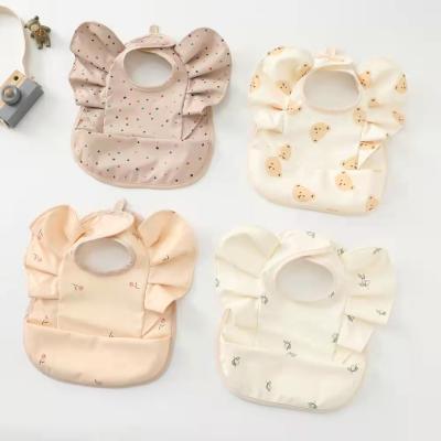 China High Quality Waterproof PU Baby Bib New Washable Raytop Design for sale