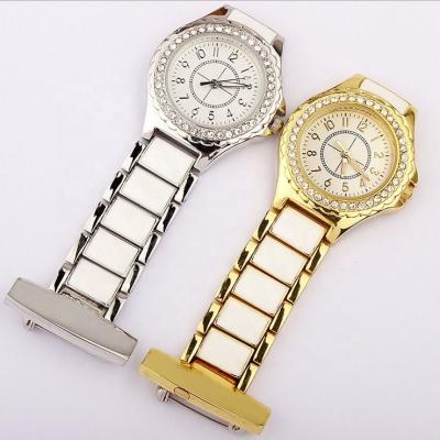 China Fashion Arabic Numerals Gold Silver Quartz Nurse Watch Removable Pendant Diamond Watches Men Women for sale