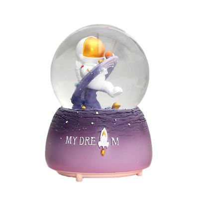 China China Astronaut Crystal Ball Ornament Astronauts Pilot Space Music Box Bedroom Decoration Glowing Home Music Box for sale