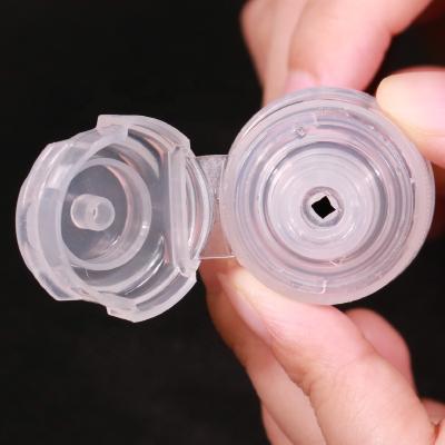 China Non Spill Manufacturer 28mm 1881 Shampoo Bottle Flip Top Cap Flip Top Caps With Silicone Valve for sale