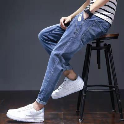 China QUICK DRY Men's Special Clearance Youth Straight Slim Light Blue Jeans Pants Wholesale Fat Man Jeans for sale