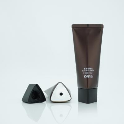 China Cosmetic Triangle 100g Plastic Tube Packaging Tube For Face Seal With Triangle Cap for sale