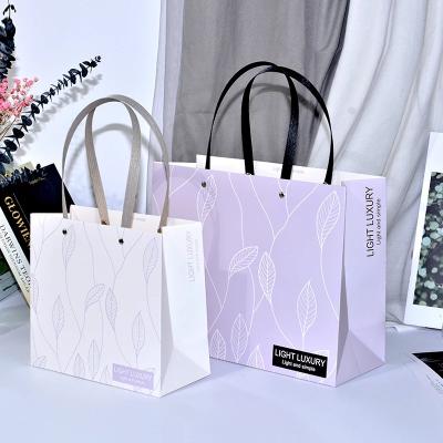 China Wholesale Recyclable Paper Bag Cheap High Quality Printed Gift Custom Printed Paper Bags Fashion White Clothes Paper Bags for sale