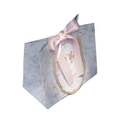 China Recyclable Luxury Custom Paper Bag Gift Paper Bags With Ribbon Bowknot for sale