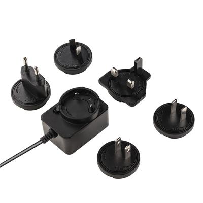 China UniversalÂ   Interchangeable US EU UK AU Plug AC DC Power Supply 18W Power Adapter for sale