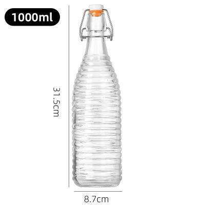 China 1000 ml botellas de vidrio con tapa transparente con tapa hermética para jugo de cerveza de agua en venta