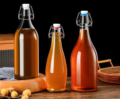 China Durchsichtige und durchsickernde Mini-Flaschen mit bequemer Aufbewahrung Schwingende Glasflaschen für Getränke Öle Kombucha zu verkaufen