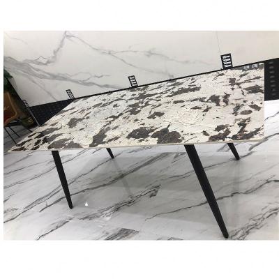 China New Design Emission Luxury Dining Room Black Frame Chipboard Stone Black Sand Carbon Steel Dining Room Furniture Dining Table for sale