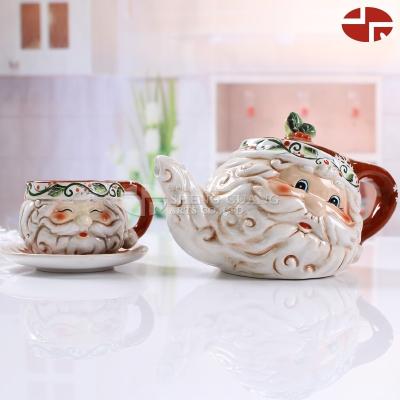 China Modern Design Viable Ceramic Tea Set Cup Saucer And Teapot Set In Christmas Santa Claus Shape Painting Design for sale