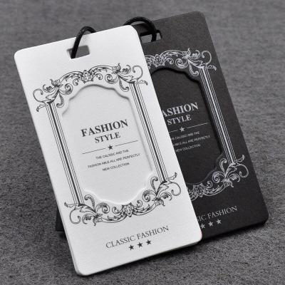 China Especially viable foiled embossed paper cavity printing customized with UV clothes hanger tag paper label for jeans clothing and garment for sale