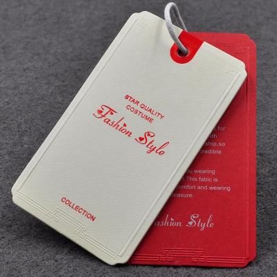 China Both viable pcs set specially foiled embossed paper printing customized and UV garment label paper tag for jeans clothing and shoes for sale