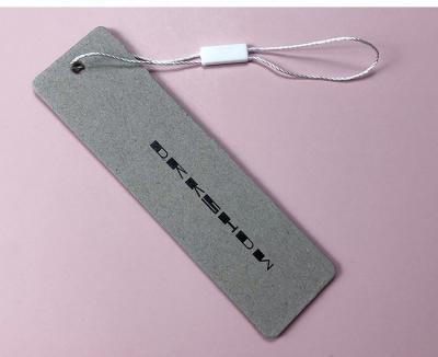 China Sustainable High Quality Embossed Customized Printing Foiled Customized With UV Clothes Hang Tag Paper Tag For Jeans Clothing And Garments for sale