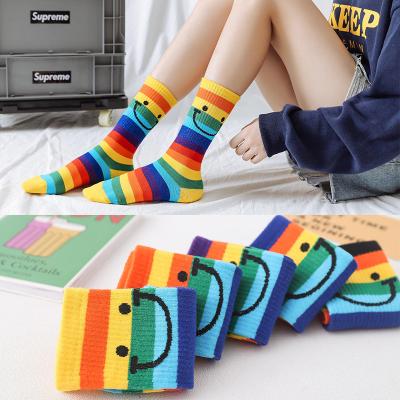 China Beautiful cartoon antibacterial pure cotton Yueli face tube rainbow stripe college sports smile female socks for sale