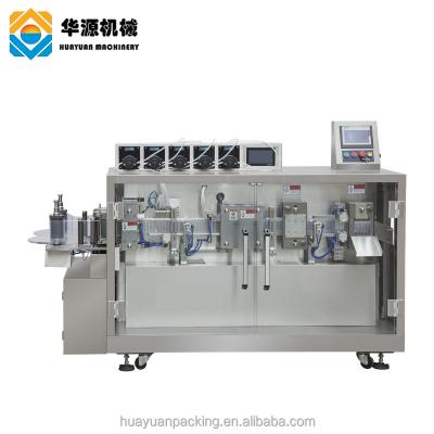 China HUAYUAN 50ml - 100ml Food Bottle Full Automatic CNC Oil Milk Quantitative Packing Liquid Filling And Sealing Machine for sale