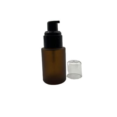 China Cosmetic 30ml Frosted Cylinder Glass Pump Bottle Luxury Eco-friendly Amber Cosmetic Cream Bottle for sale