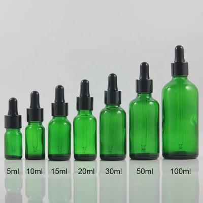 China European Green Cosmetic Round Glass Bottle For Essential Oil 5ml 10ml 15ml 20ml 30ml 50ml 100ml Caliber 18mm for sale