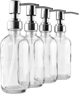 China Chemical 8 Ounce Clear Glass Boston Round Bottles With Stainless Steel Lotion Pumps for sale