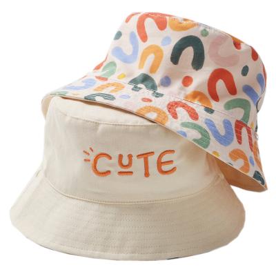 China Custom Casual Cute Unisex Kids Sun Hat Summer Logo Embroidery Reversible Print Kids Bucket Hats for sale