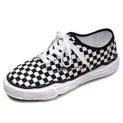 China Rubber Plain Black White Empty Bulk Stock Vulcanized Rubber Shoes Men Wholesale Cheap Canvas Shoes for sale