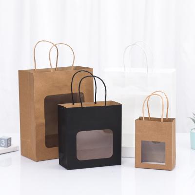 China Recyclable Brown Kraft Clothes Food Paper Tote Bags Custom Size Luxury Kraft Paper Bags With Handle Window Your Own Logo for sale