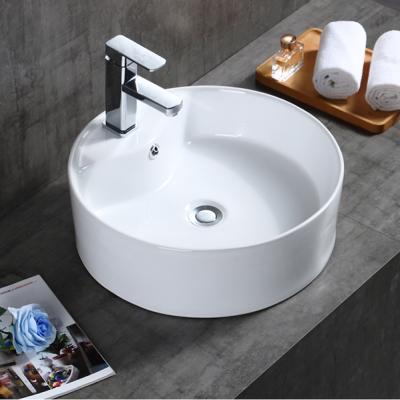 China Bathroom Easy Clean White Color Tarpul China Ceramic Hand Wash Sink Around Circular Ceramic Sink for sale