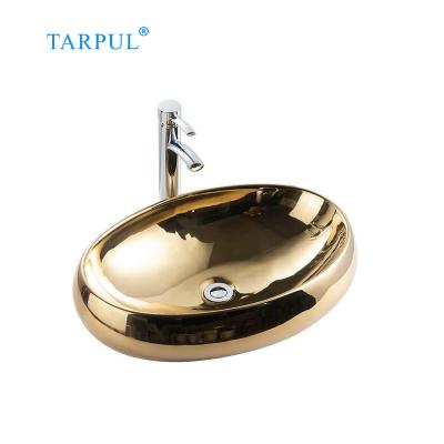 China 2020 New Design Modern Art Gold Basin Oval Ceramic Countertop Bathroom Sinks for sale