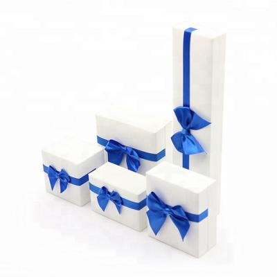 China Trendy Wholesale Custom Logo White Paper Packaging Jewelry Boxes With Ribbons Bow for sale